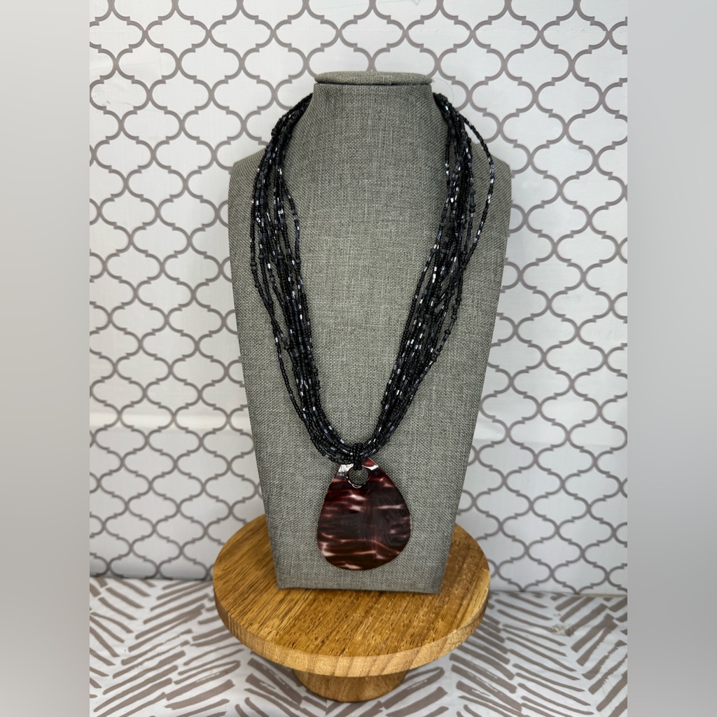 Elegant Glass Bead Necklace With Mother-Of-Pearl Charm In Black And Brown.